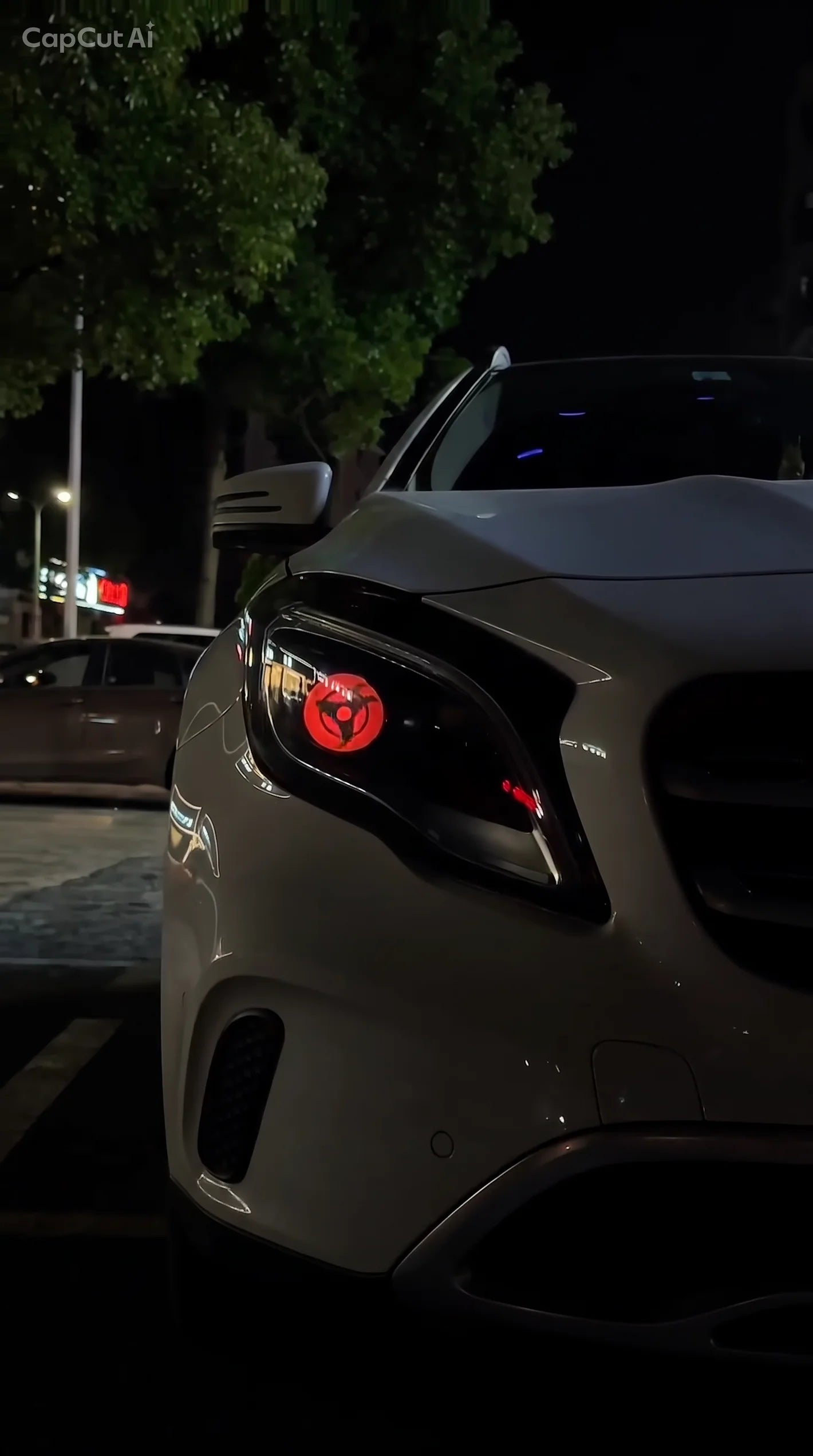 Grey car with red LED Light Eye at night